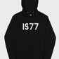 This classic black 1977 Essentials Hoodie displays the prominent white graphic numbers across the chest for a clean, timeless look.