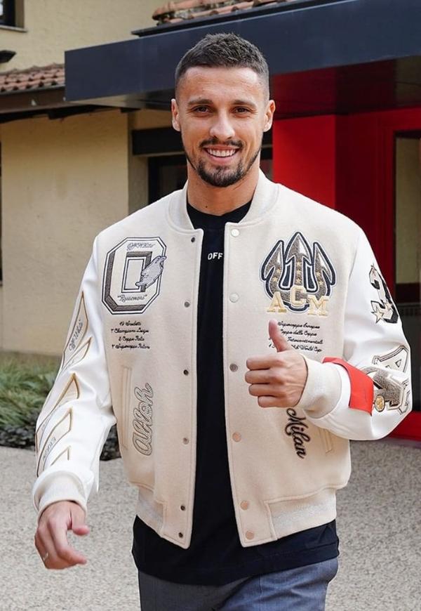 A guy is wearing AC Milan Off white Varsity Jacket while showing thumbs up sign