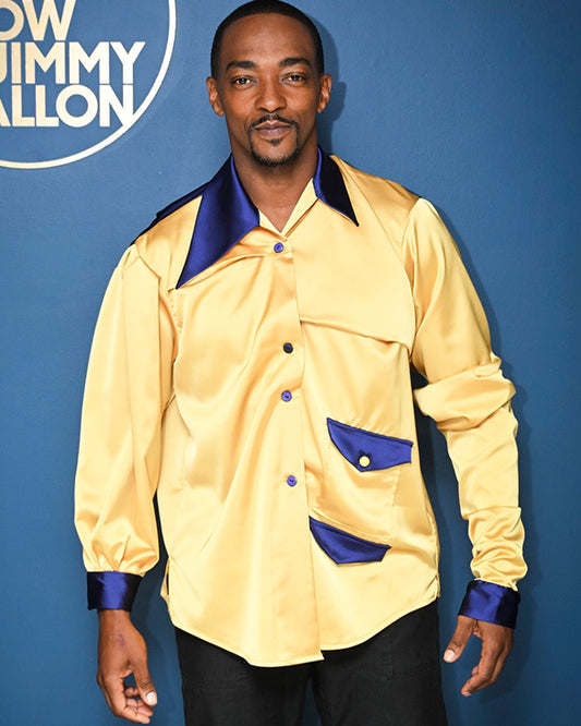 Anthony Mackie a yellow satin shirt with blue accents against a blue background with 'The Tonight Show Starring Jimmy Fallon' logo.