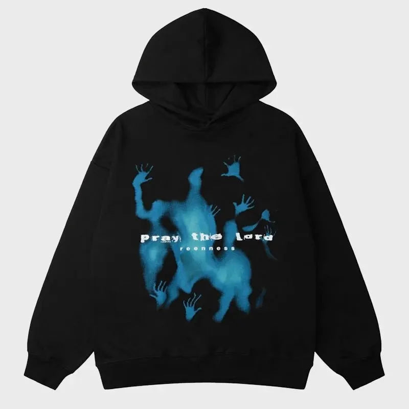 Front view of an oversized black cotton pullover hoodie featuring a blue, ethereal graphic print and the phrase 'Pray the Lord' on the chest.