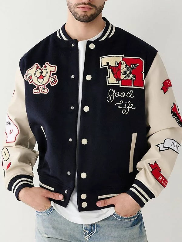 Person wearing a True Religion Letterman Jacket with various patches and designs.