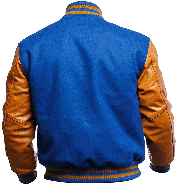 Blue varsity jacket with brown leather sleeves on a white background