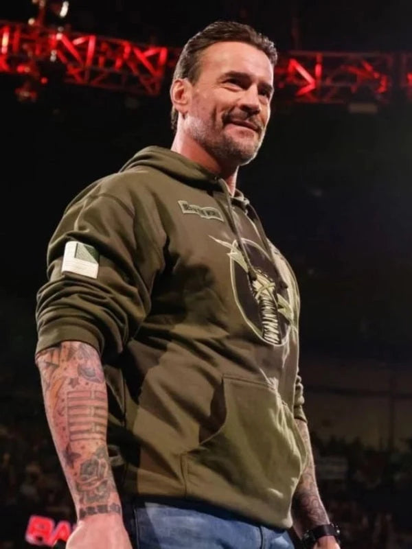 Official CM Punk "Best in the World" olive drab pullover hoodie. Mid-weight fleece with military-style chest graphic and tactical patch detail.