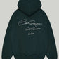 Back view of the premium Deep Forest Green Cole Buxton Oversized Hoodie, highlighting the large, crisp white signature script graphic with the Soho, London 2020 text.