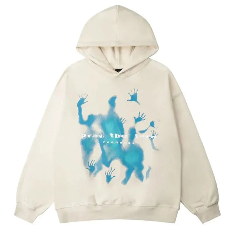 Front view of an oversized ecru cotton pullover hoodie with a vibrant blue, ethereal graphic print and the text 'Pray the Lord' on the chest.