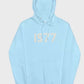 This serene light blue 1977 Essentials Hoodie features the subtle cream-colored numerical design, presenting a fresh and versatile style.