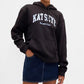 Person wearing a black hoodie with 'KATIEYE' branding on a white background
