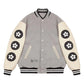 Gray varsity jacket with white sleeves featuring black flower patterns on a white background