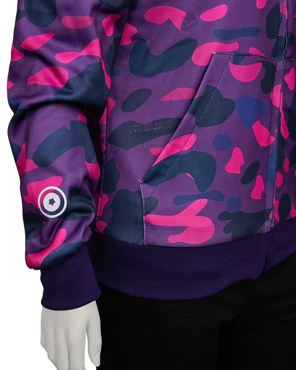 Close-up detail of the ribbed cuff, hem, and front pocket area on a violet, pink, and navy camouflage full-zip hoodie.