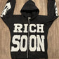 Front view of Black Rich-Soon-Zip-Up-Hoodie-Black