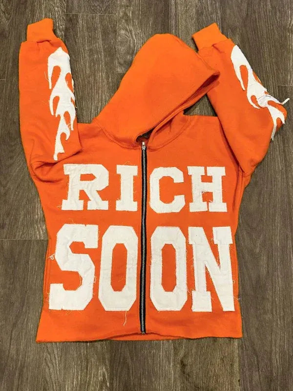 Front view of Orange Rich-Soon-Zip-Up-Hoodie