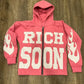 Front view of Pink Rich-Soon-Zip-Up-Hoodie