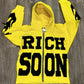 Front view of Yellow Rich-Soon-Zip-Up-Hoodie-Yellow with black flame graphics.