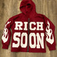Front view of Red Rich-Soon-Zip-Up-Hoodie