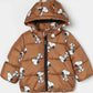 snoopy in a puffer jacket​ with dog pattern on a white background