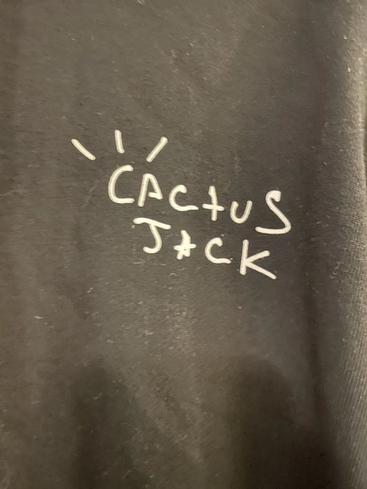 Text 'Cactus Jack' written on a black hoodie