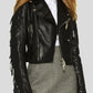 Black leather jacket with fringe details on a plain background