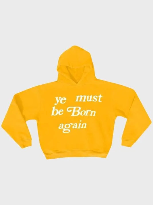 Yellow hoodie with white text "Ye Must Be Born Again Hoodie" on a light gray background