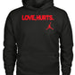 Black pullover hoodie with red "LOVE, HURTS