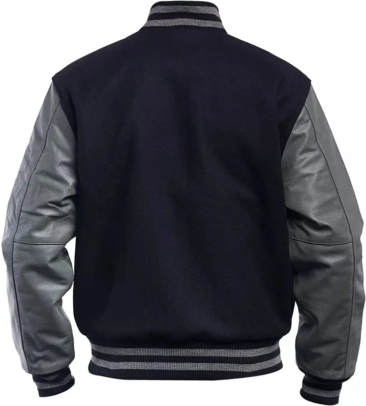 Black and gray varsity jacket with leather sleeves on a white background