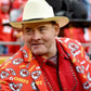 Close-up of David Koechner wearing the Red and White Kansas City Chiefs Red Blazer over a studded western shirt.