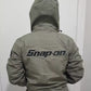 green snap on hooded jacket​ back view