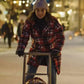 Red Plaid Home For Christmas Ida Elise Broch Jacket on a sled. Great for the holidays!