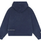Back view of the oversized navy blue hoodie showing the washed, vintage effect. Small "REAL ARTISTIC PEOPLE" text is visible near the bottom left hem, and a logo detail is on the right wrist.