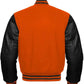Orange varsity jacket with black leather sleeves on a white background